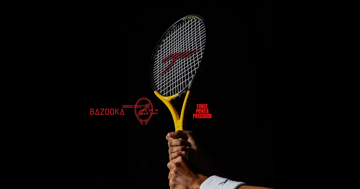 tennis color yellow in hand of the men with black background