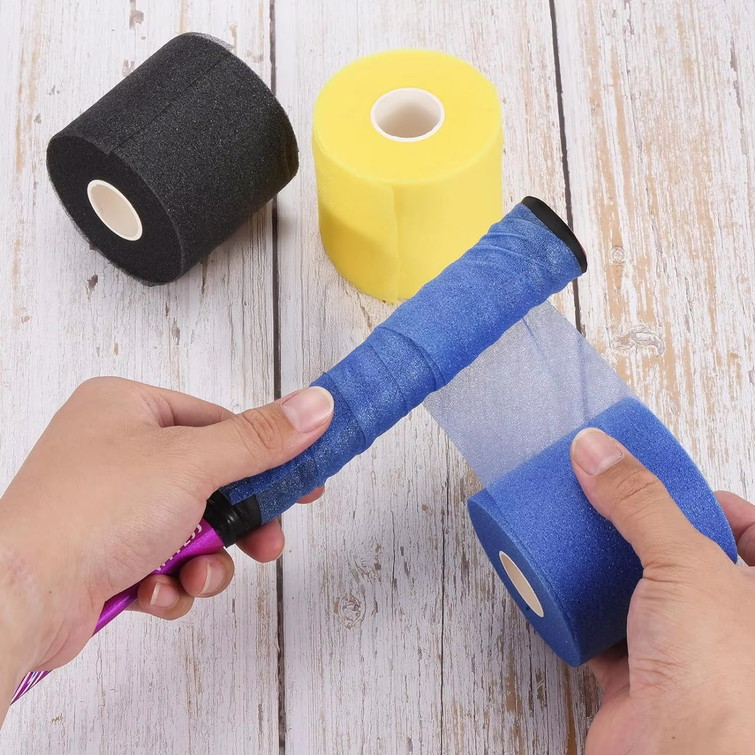 cushion wrap of blue color wrapping over the racket handle