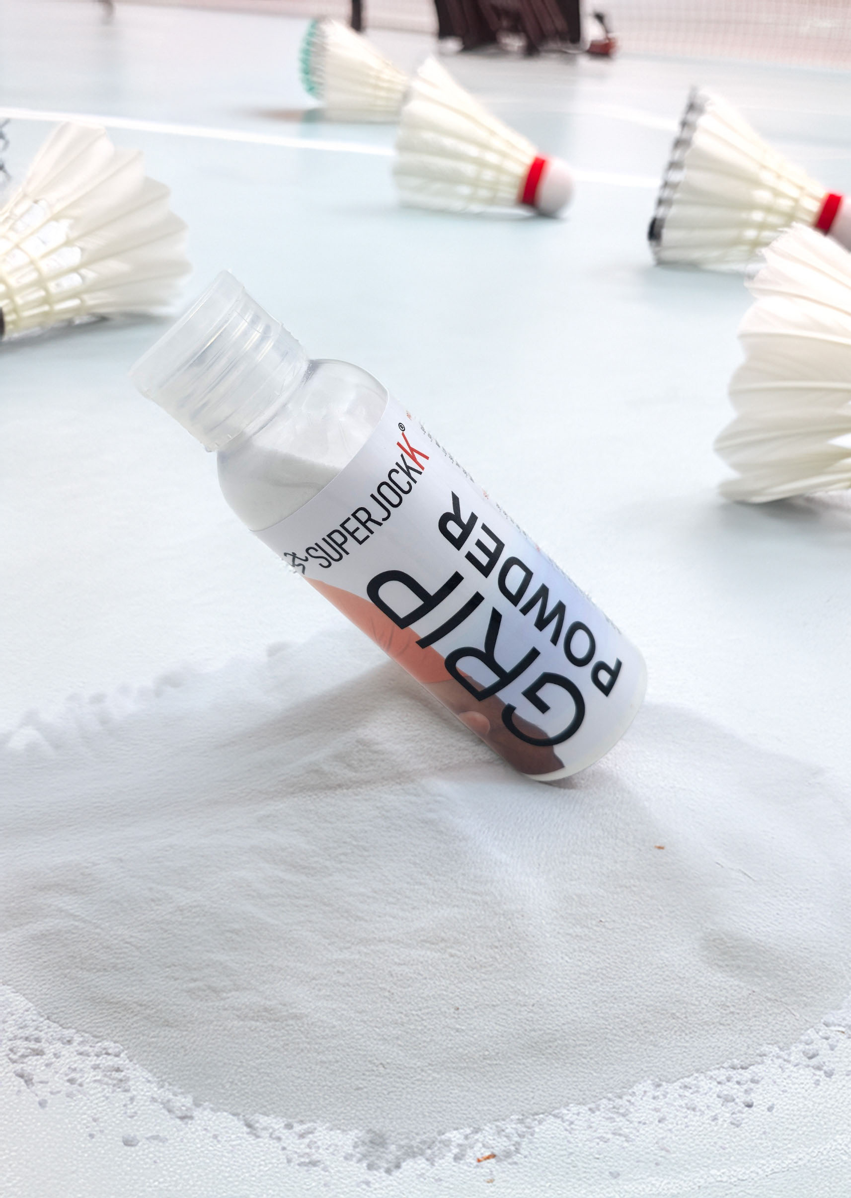 superjockk grip powder falls on badminton court